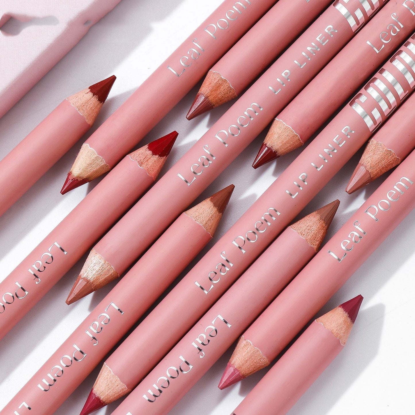 Set of Leal Poem lip liner pencils on a light background