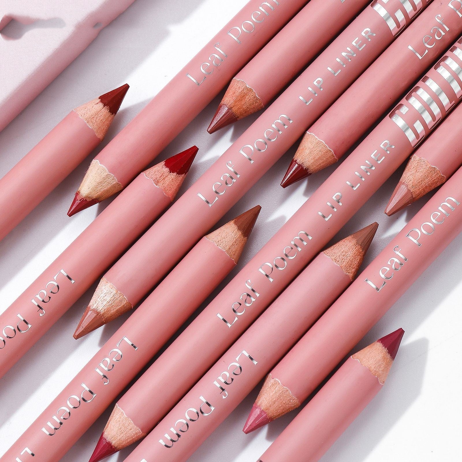 Set of Leal Poem lip liner pencils on a light background