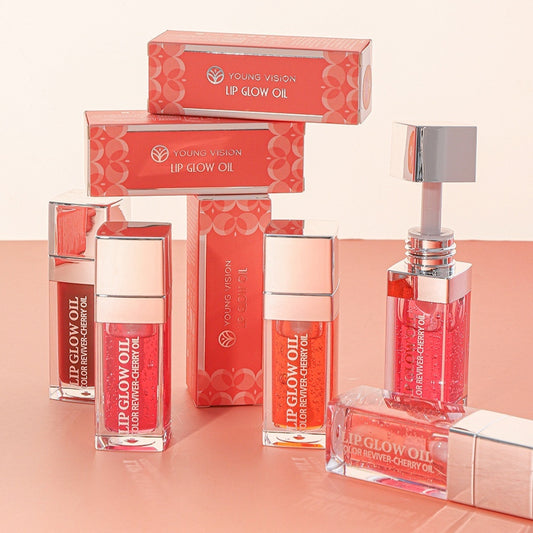 Young Vision Lip Glow Oil packaging on a peach background